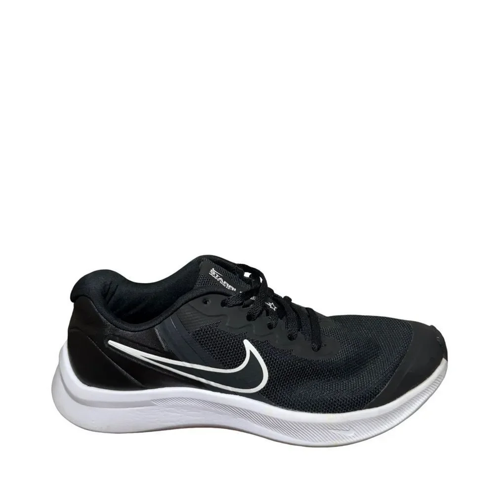 Nike women’s Black and White Low-Top Running Shoe size 5.5Y